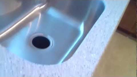 Livingstone solid surface countertop with a coved back and E220 undermount Karran sink