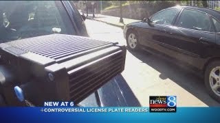 The cameras mounted to grand rapids police cars read a license plate,
and feed number into computer that flags plate if car, or someone in
it, ...