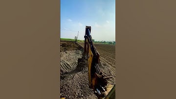JCB 3dx loading mud in tractor mahindra