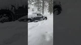 Ford raptor in deep snow Lake Tahoe