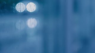 FREE Blurred Rainy Street Scene - Car Headlights - Bokeh Urban Background