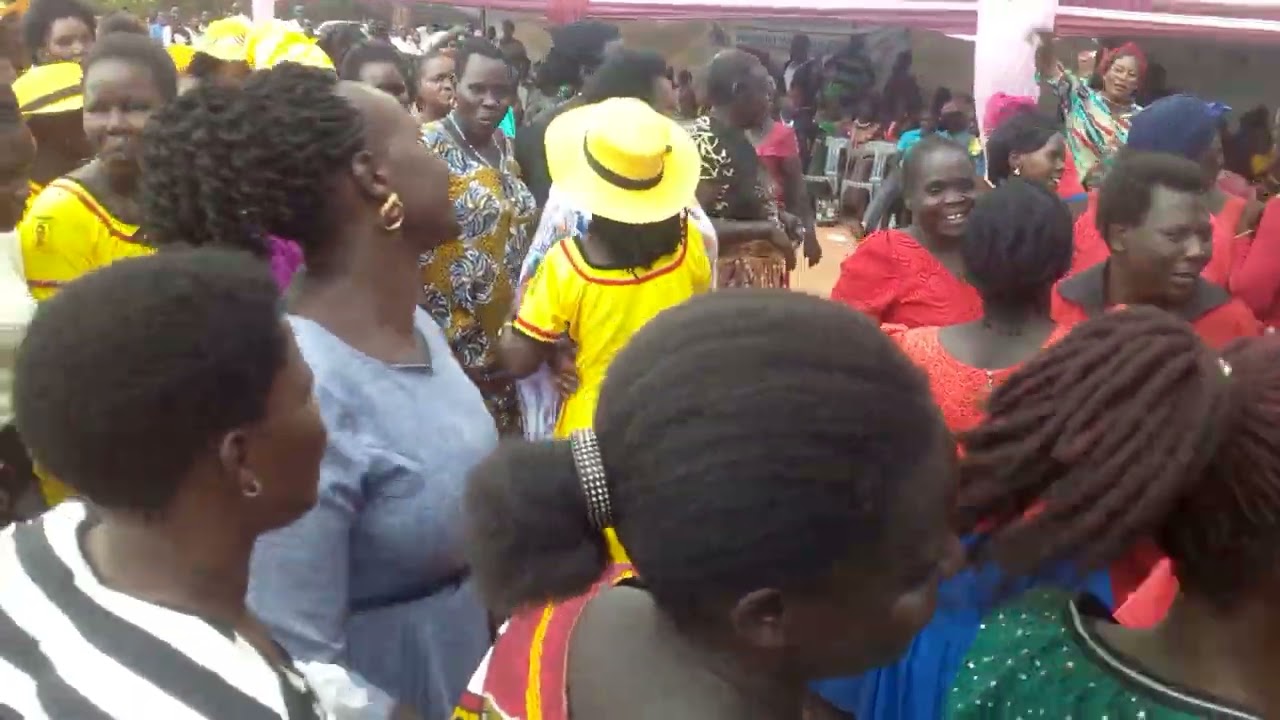 Hon.Minister of Gender, Labour & Social Dev't Betty Amongi dances yoo leng with Lira City Women.