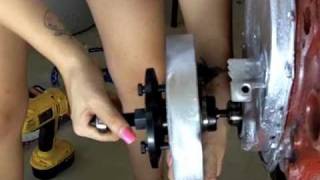 Stephanie pulls a harmonic balancer off a chevy small block