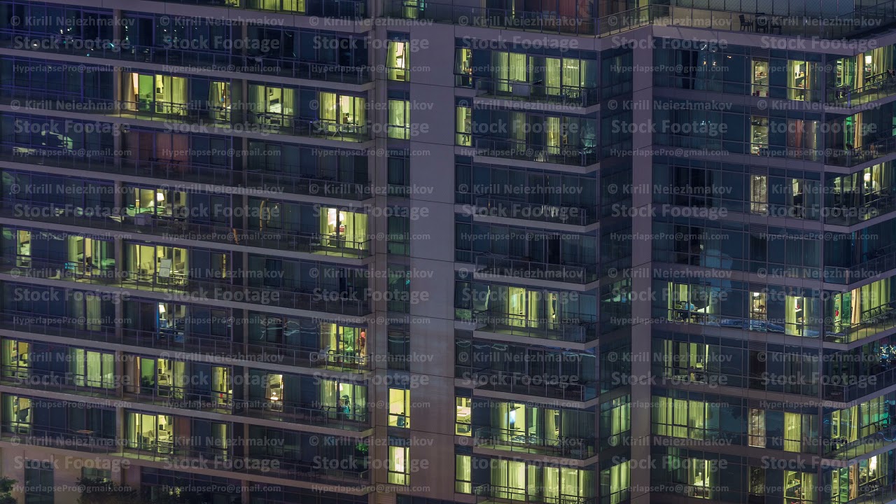 Windows lights in modern office and residential buildings timelapse at night