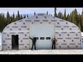 The walls go up on the quonset hut  overhead shop door install