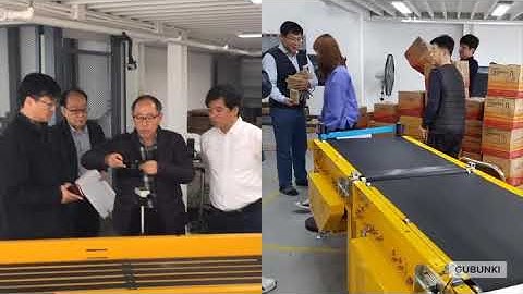 Conveyor induction and wheel merger for loop type wheel sorting system