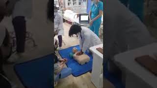 Doctor slap dummy while doing CPR