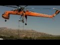 Aircrane Lifting A Bridge of a high line transmission lattice tower