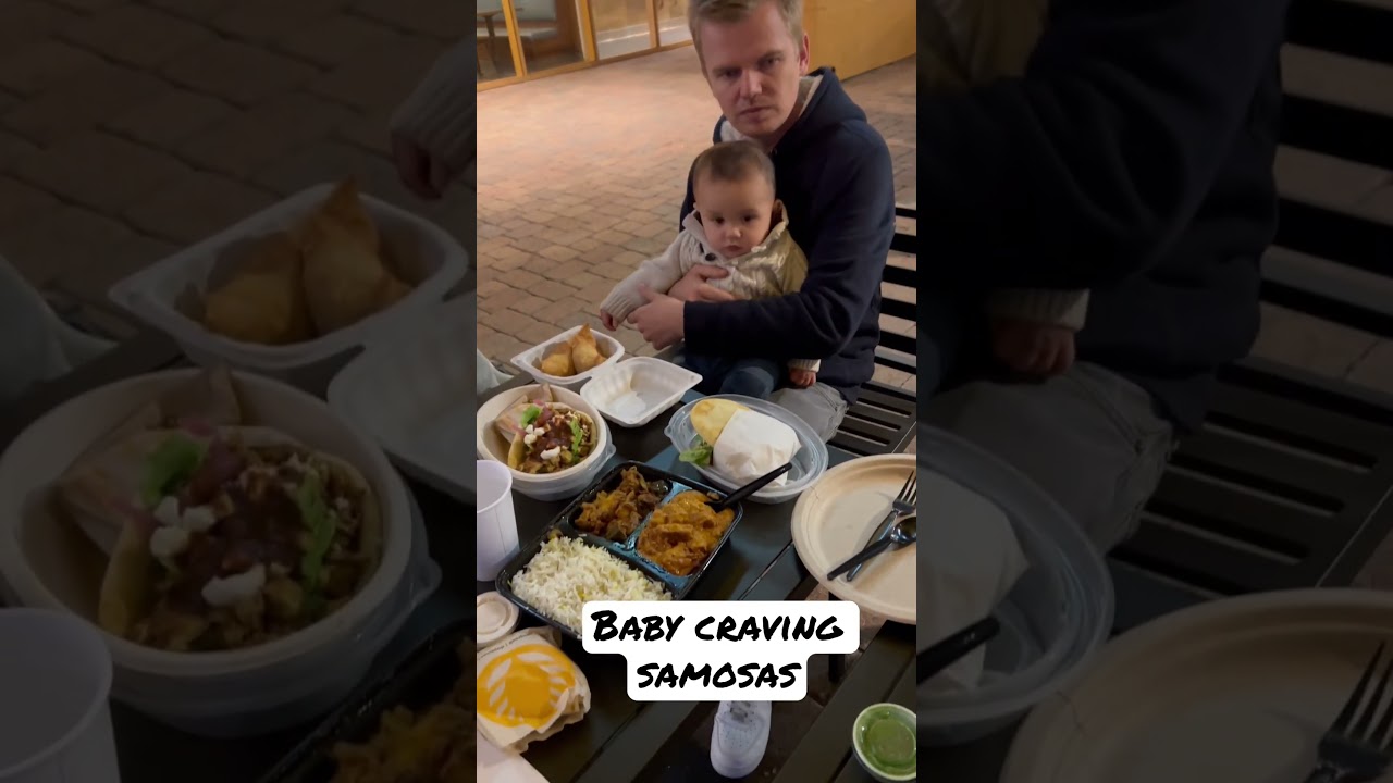 Baby and daddy having Indian food