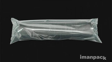 Inclined packaging machine for plastic lids