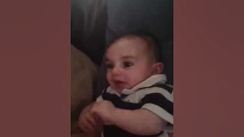 Max laughing on the couch