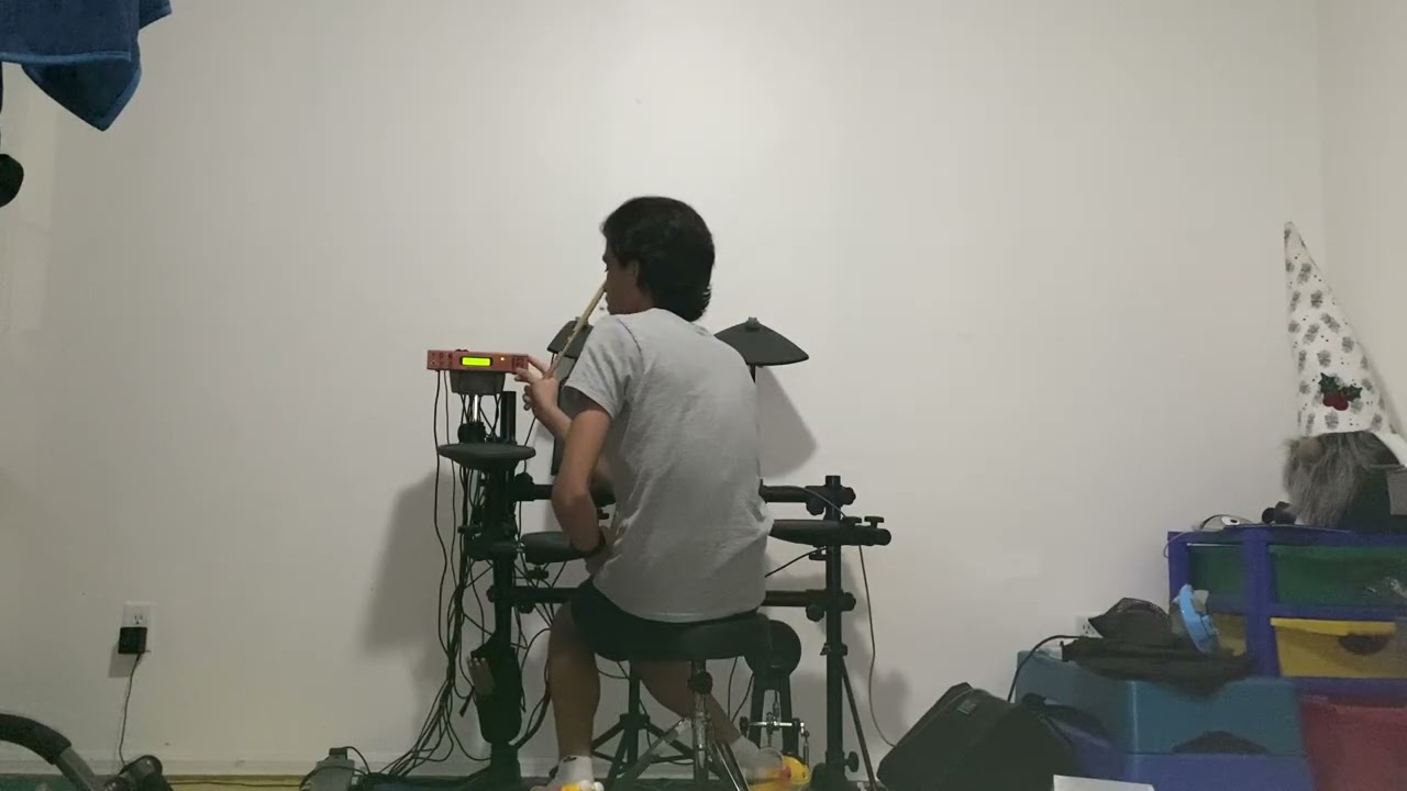 I am playing the electric drum set. (AN INSTRUMENT THAT IS AN ELECTRIC!)