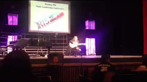 Rachel Crist sings at the talent show during the A...