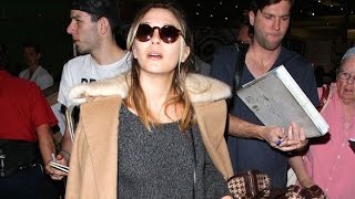 Elizabeth Olsen Surrounded By A Hoard Of Fans At LAX