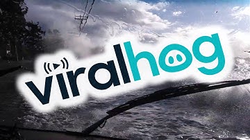 Waves Crash over Road During Storm Surge || ViralHog