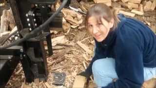 My wife splitting firewood with Menards Forest King 22 ton