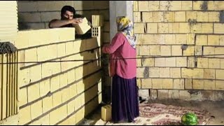 Razieh is preparing food for the construction workers in the hope of a beautiful building