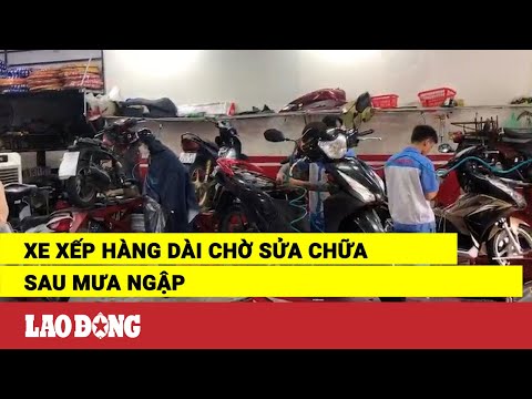 Video Xe xếp hàng dài chờ sửa chữa sau mưa ngập | Báo Lao... - youtube