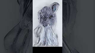 I made a wispy grim reaper using epoxy resin and alcohol ink for Halloween