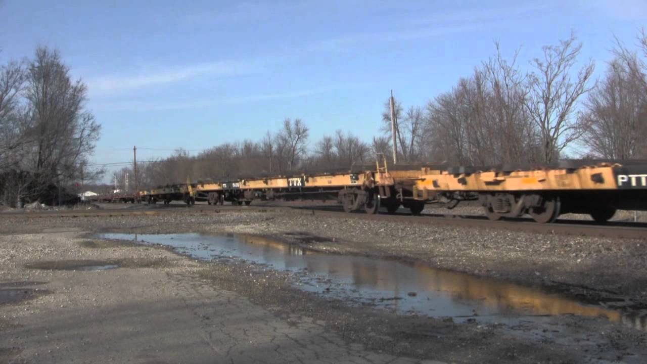 CN 2324 and IC 2706 Lead Empty Pipe Train Jacksonville, IL 03/05/12