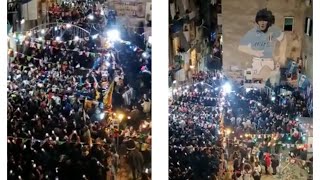 People celebrating Argentina win at the Maradona wall in Naples