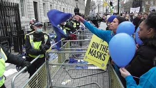 PROTEST CALL THE POLICE TRAITORS AS THE NHS THROW THEIR UNIFORMS AT THE POLICE #WorldWideDemo