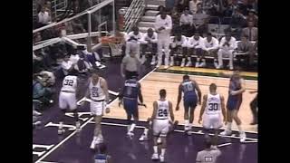 Karl Malone delivers an elbow to Isiah Thomas
