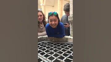 me singing into a well in italy