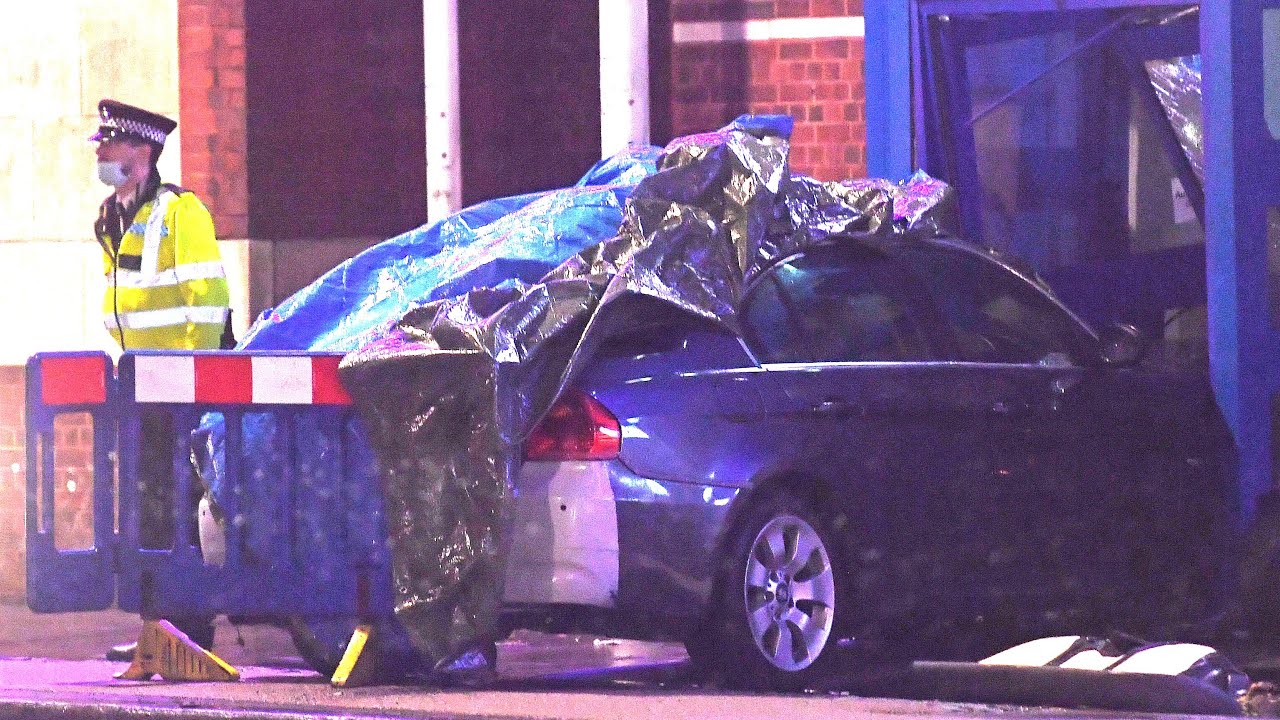 Man arrested after car crashes into police station in north London ...