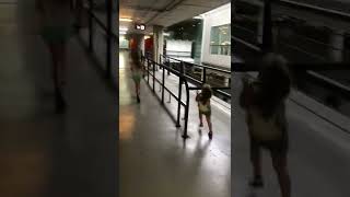 Little girl and her sister run in parking garage then she crashes face first into pole