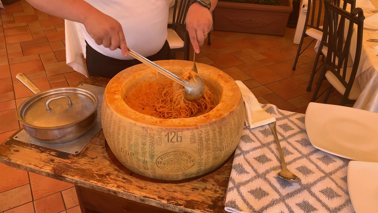 Gianni's Ristorante in Aruba stirring pasta in Cheese Wheel YouTube