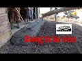 Pouring concrete in front of the shop With a assist from the Hyundai Hx85A