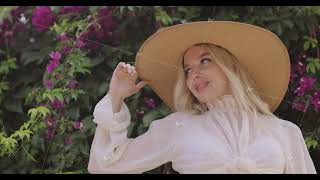 Blonde Woman Posing in Romantic French-Style Summer Outfit