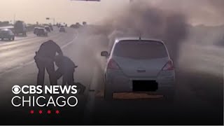Texas police officer rescues man from burning car