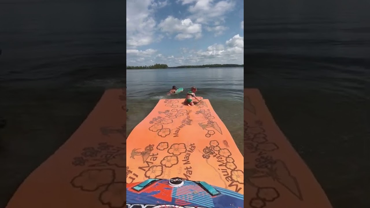 Olivia and mommy jump off the Maui mat. Cotton lake 7-17-2022