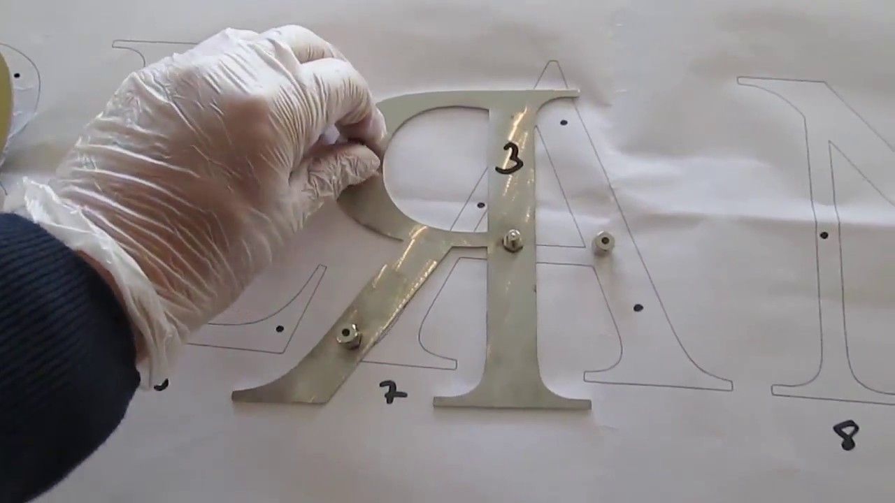 gold coloured stainless steel letters