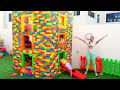 Vlad and Niki play with colored toy blocks and build Three Level House