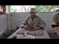 Cuban tobacco farmer shows how he rolls a cigar