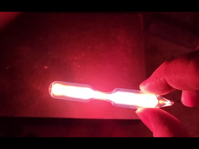 Neon discharge tube excited by a tesla coil.