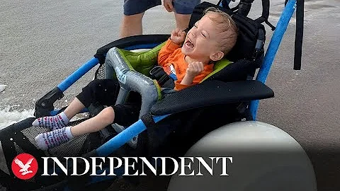 Toddler with cerebral palsy enjoys the sea for the...
