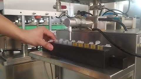 Semi automatic vertical viscous product filling machine with mixing heating hopper