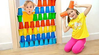 Kids play with colored cups and learn how to share