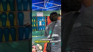 Pria ini punya cara curang untuk memenangkan permainan pecah balon!