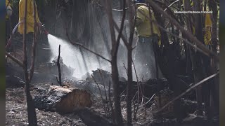 Albuquerque Fire Rescue contains smoldering wood pile in the Bosque Bosque Fire In Albuquerque