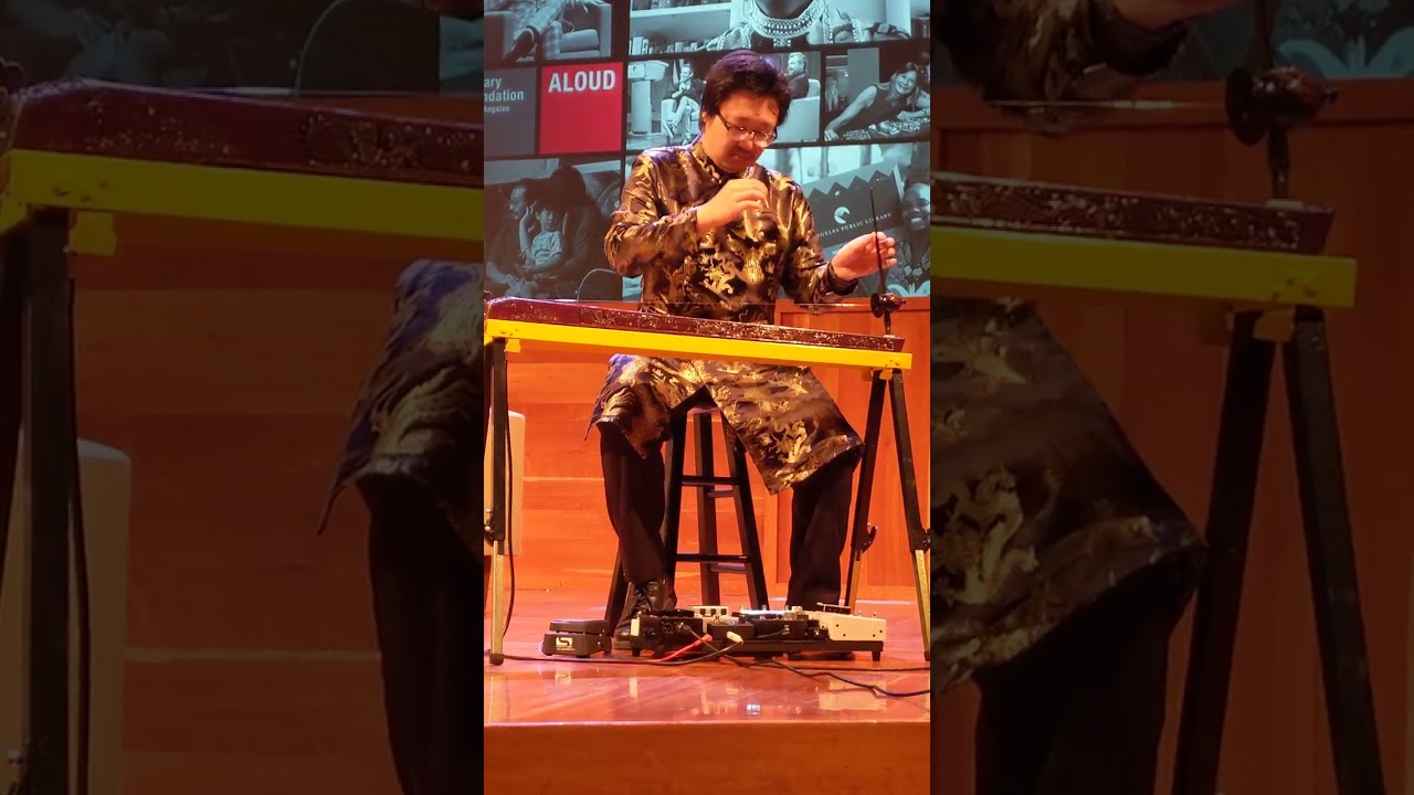 Dr. Jason R. Nguyen plays traditional Vietnamese dan bau