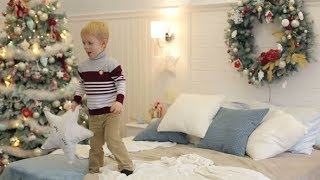 Little Boy Jumping On Bed Near The New Year Tree. Stock Footage - Videohive