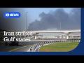 Civilian buildings hit in Dubai, Bahrain as Iran closes the Strait of Hormuz | ABC NEWS