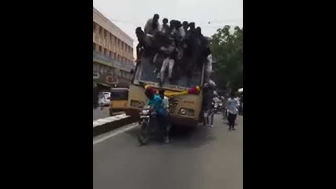 Students fall off from the top of moving bus