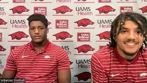 Arkansas DE Jordan Domineck and NB Myles Slusher d...