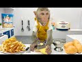 Baby monkey bim bim cooking french fries and swims with the funny duckling in the water park